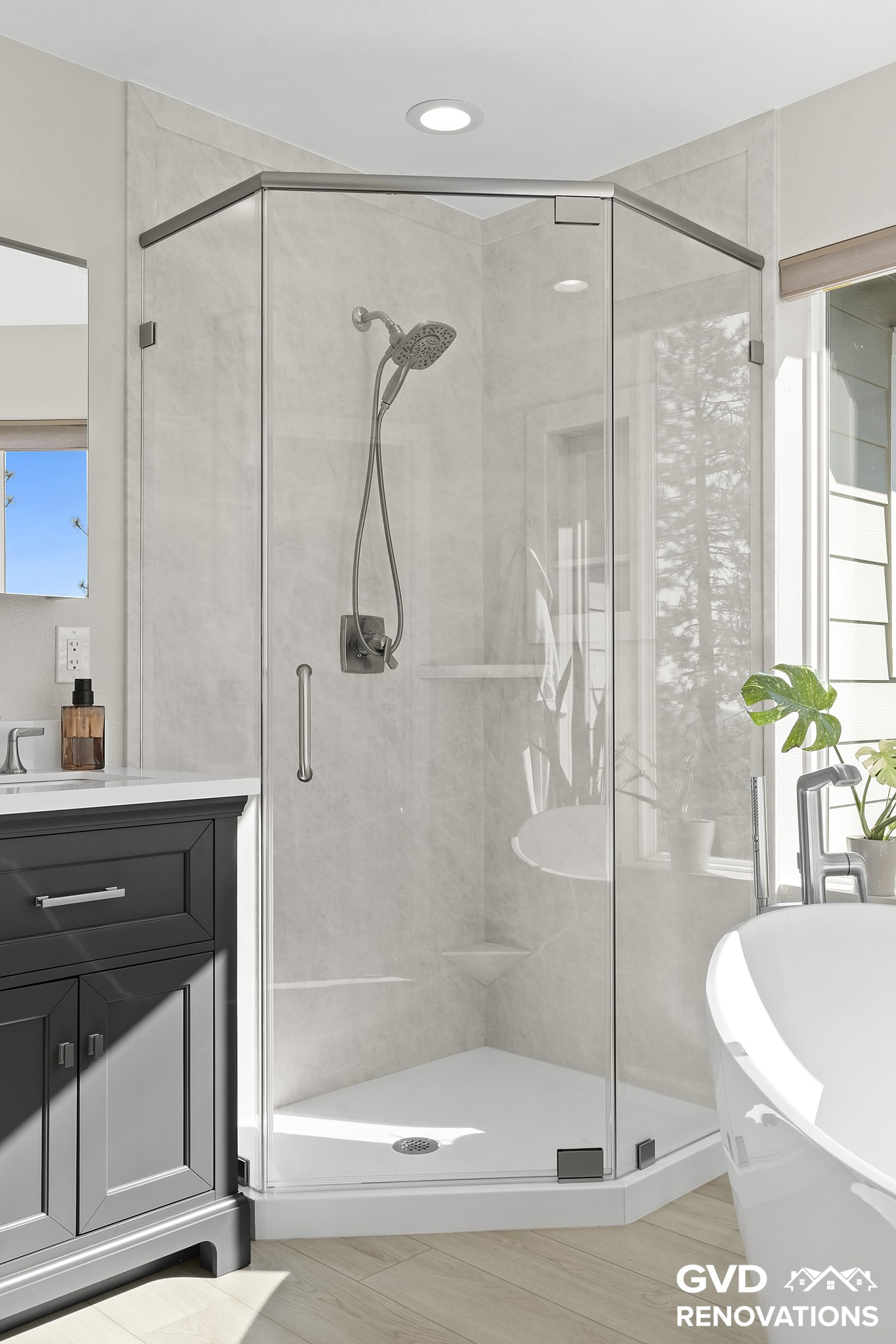 Neo-angle walk-in shower with a frameless pivot glass door in marble-look solid surface
