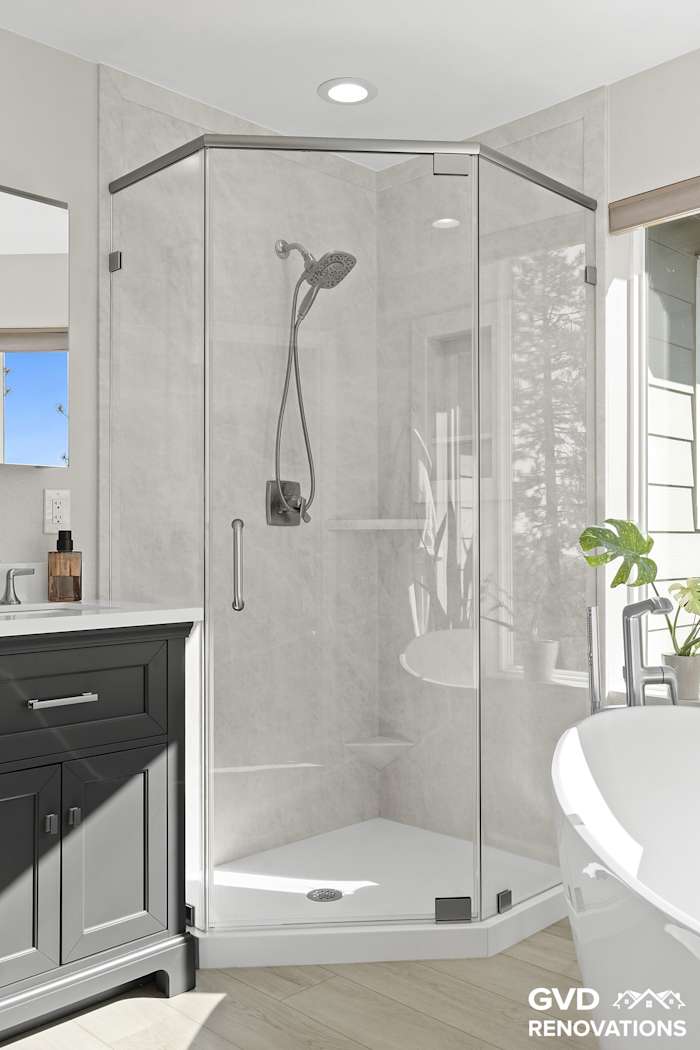 Neo-angle walk-in shower with a frameless pivot glass door in marble-look solid surface