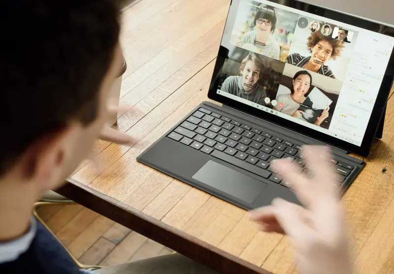 A person excitedly explaining a concept to a team on a video call