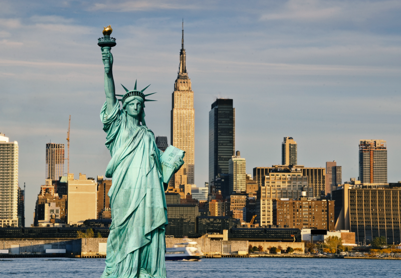 image of statue of liberty with New York skyscrapers in the background