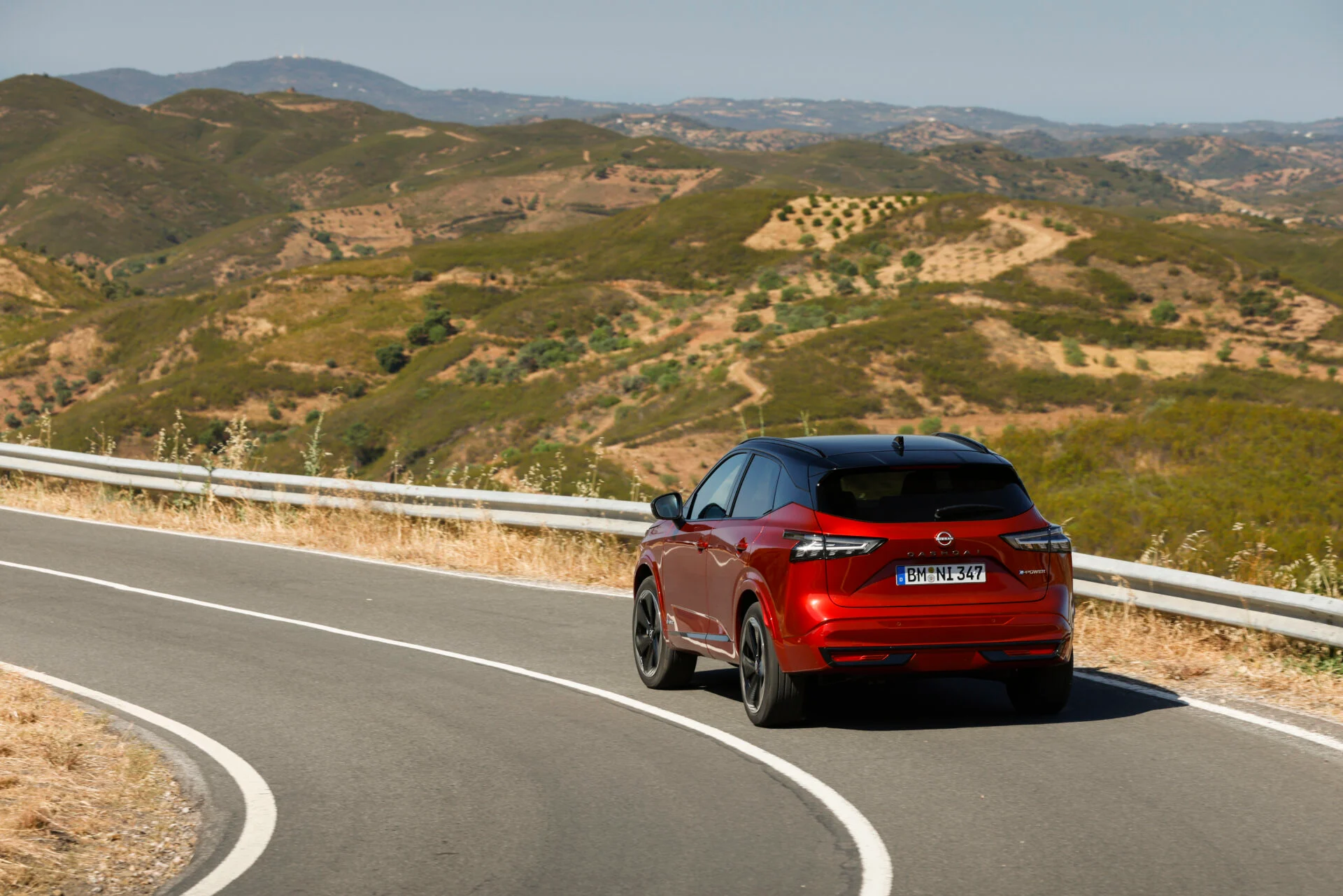 3. New refreshed Qashqai 2024 in fuji sunset color driving on the road in Faro, Portugal
