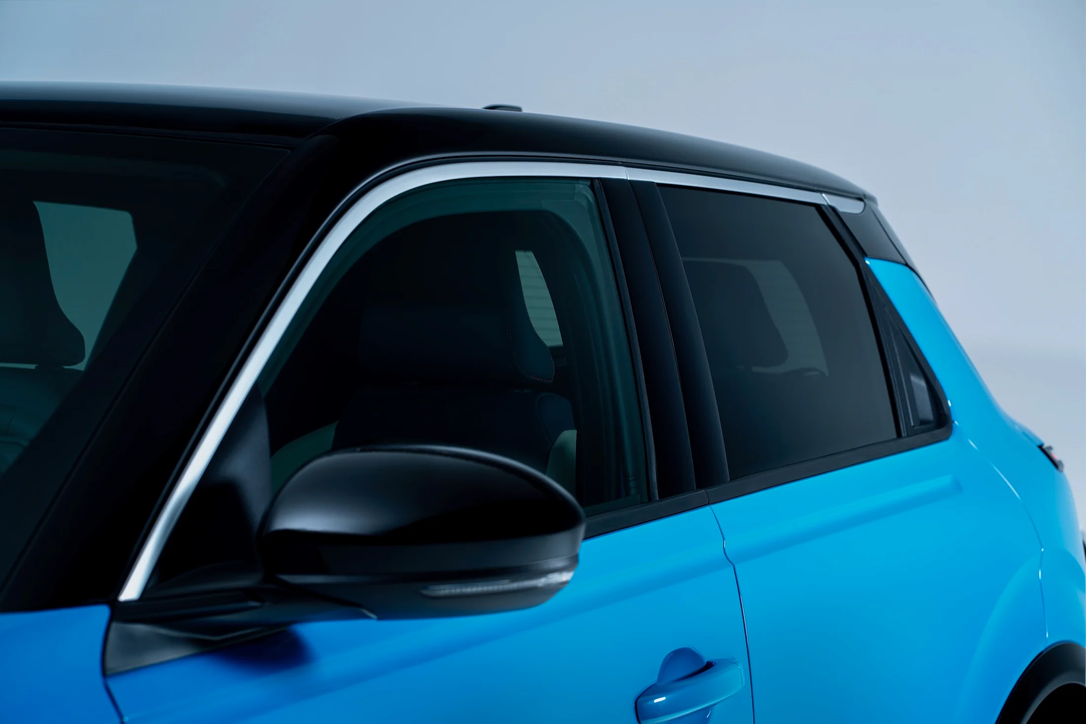 Side detailed view of Micra driver exterior door and passenger door with black roof and ice screen gelato scoop line on the side.