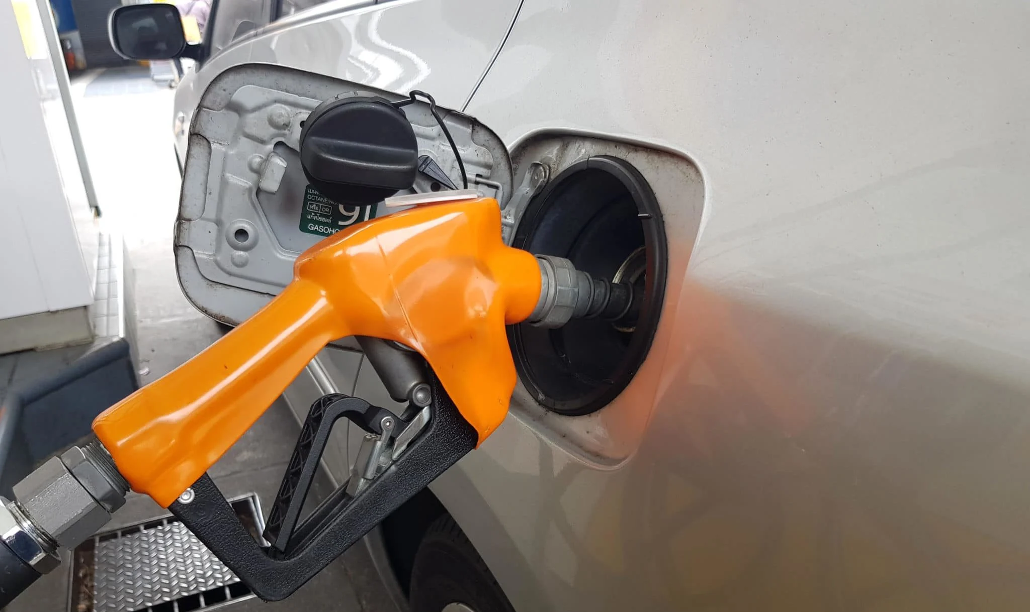 Gas pump filling up a car