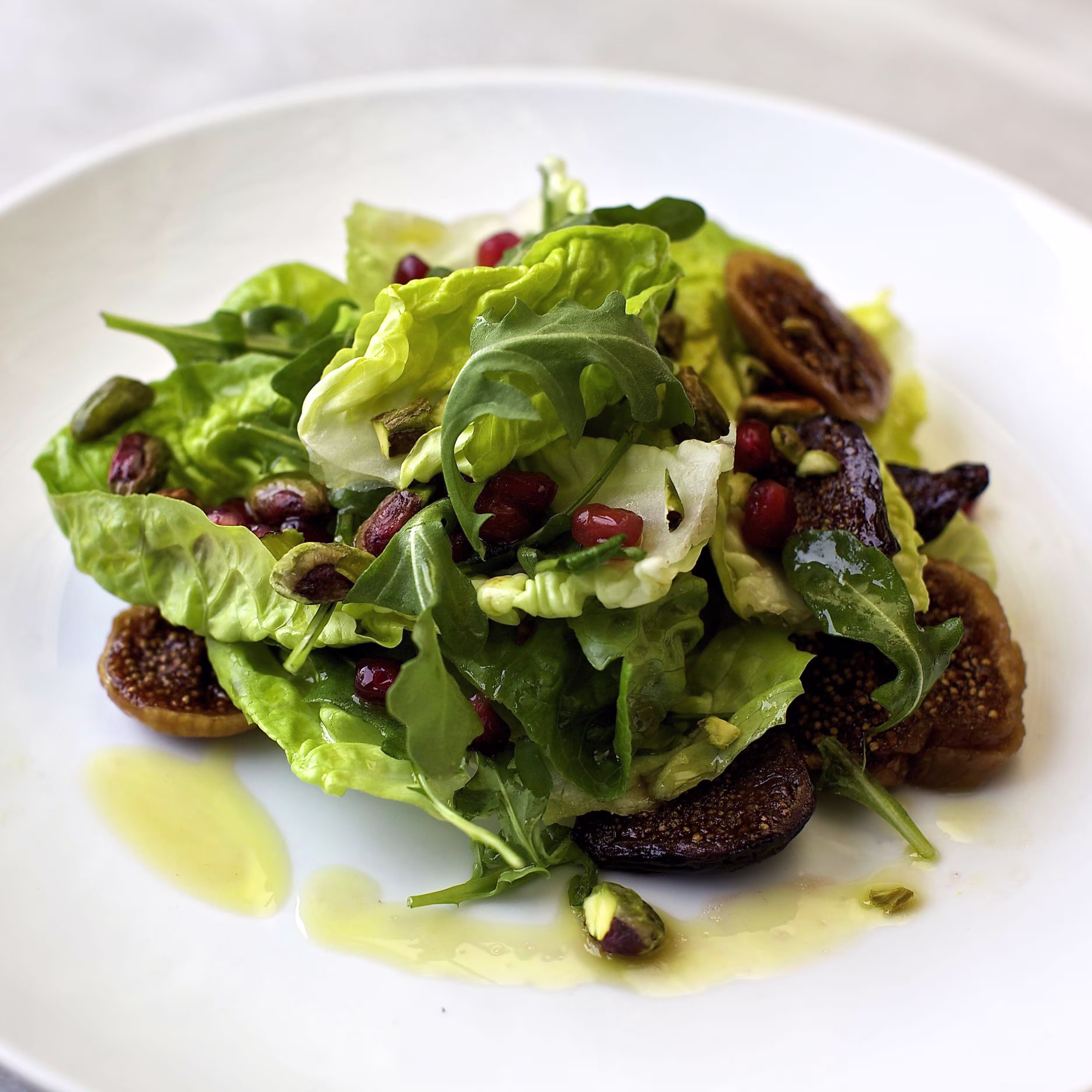 Fig & pomegranate salad on a plate