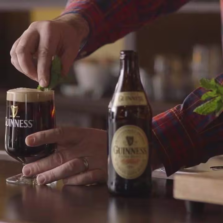 there is a chocolate cake with chocolate frosting and a raspberry on top