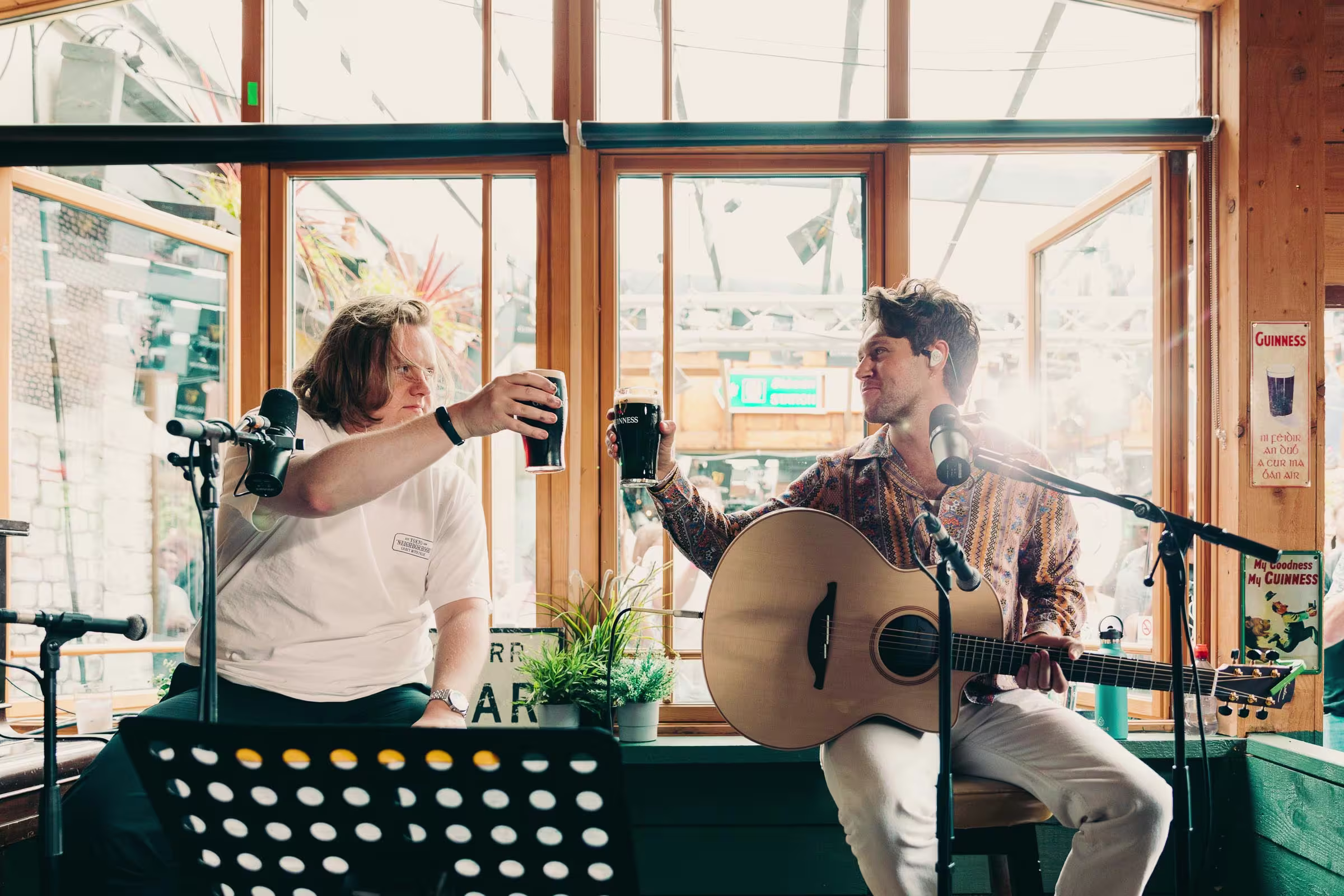 there are two people that are playing music together in a room