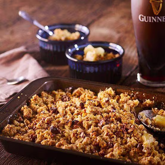 there is a chocolate cake with chocolate frosting and a raspberry on top