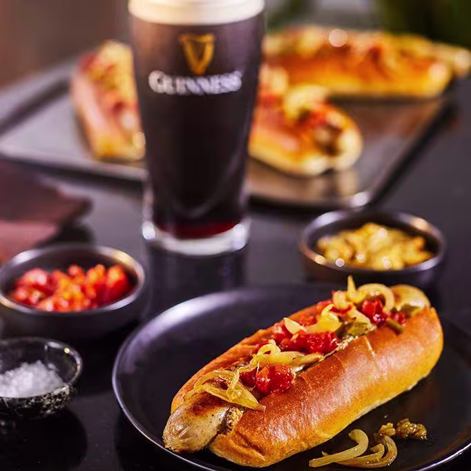 there is a chocolate cake with chocolate frosting and a raspberry on top