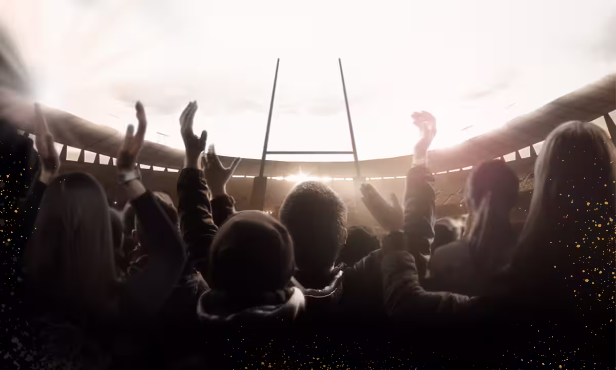Group of people at rugby pitch