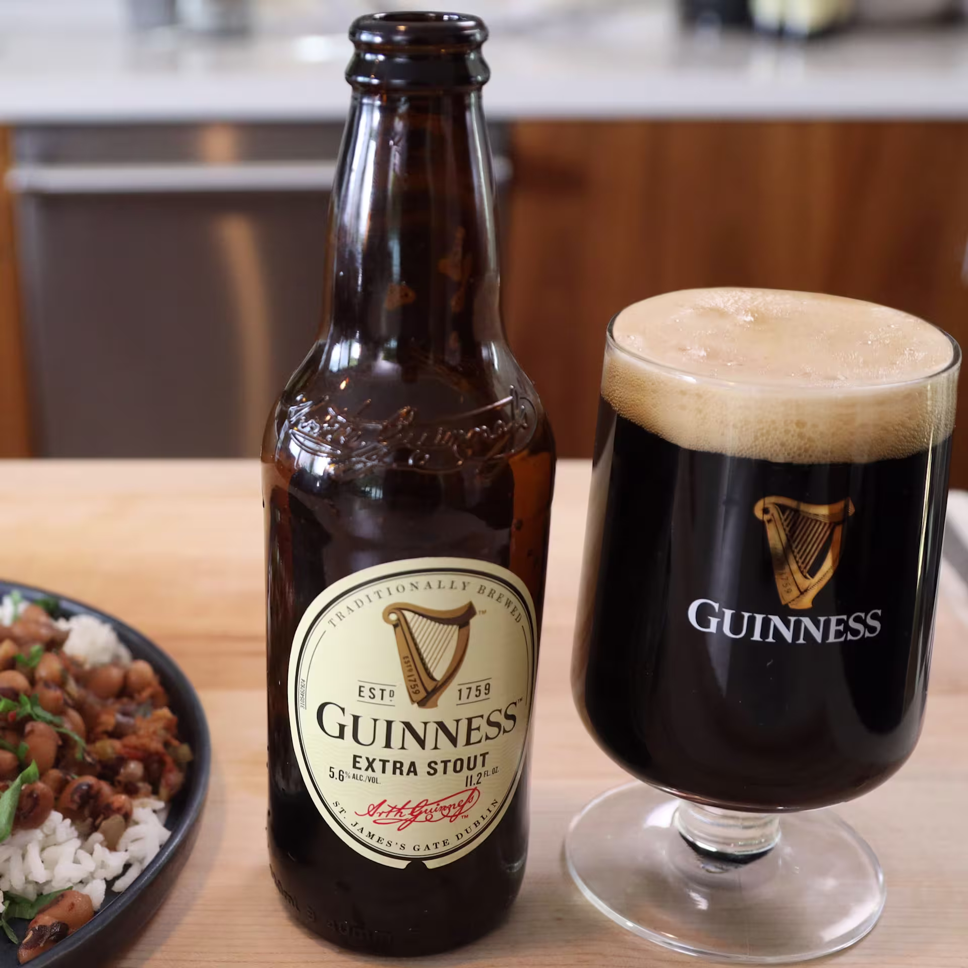 there is a chocolate cake with chocolate frosting and a raspberry on top