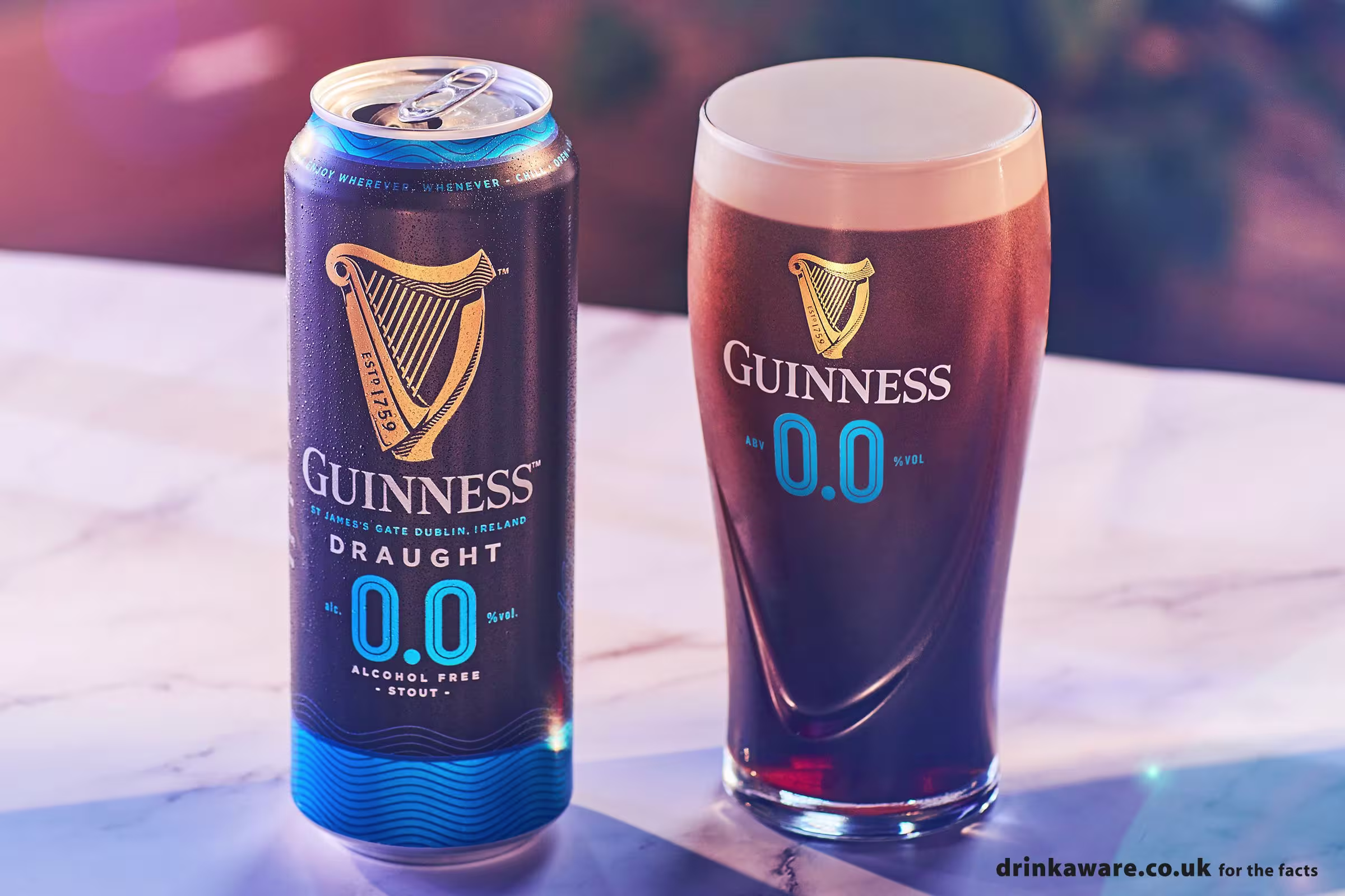 arafficial image of a glass of guinness beer and a can of beer