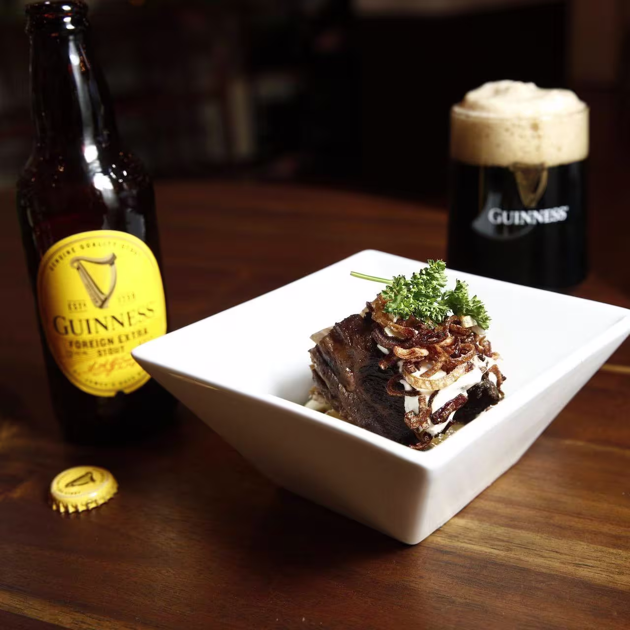 there is a chocolate cake with chocolate frosting and a raspberry on top