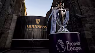 guinness st james's gate and premier league trophy