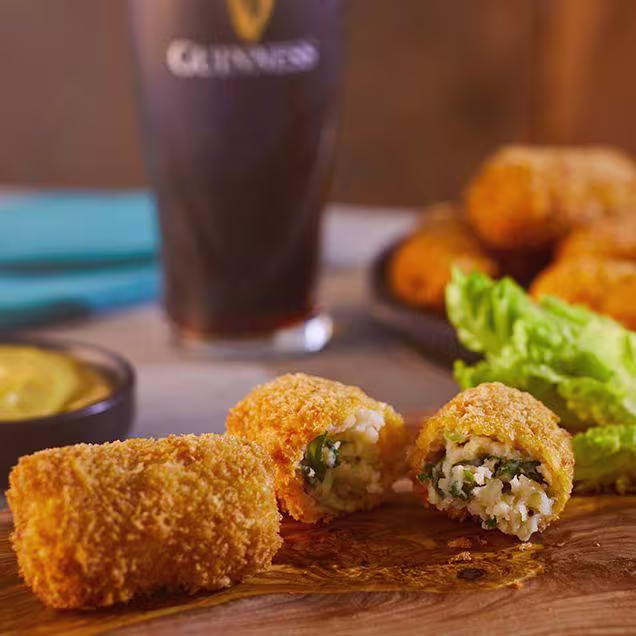 there is a chocolate cake with chocolate frosting and a raspberry on top