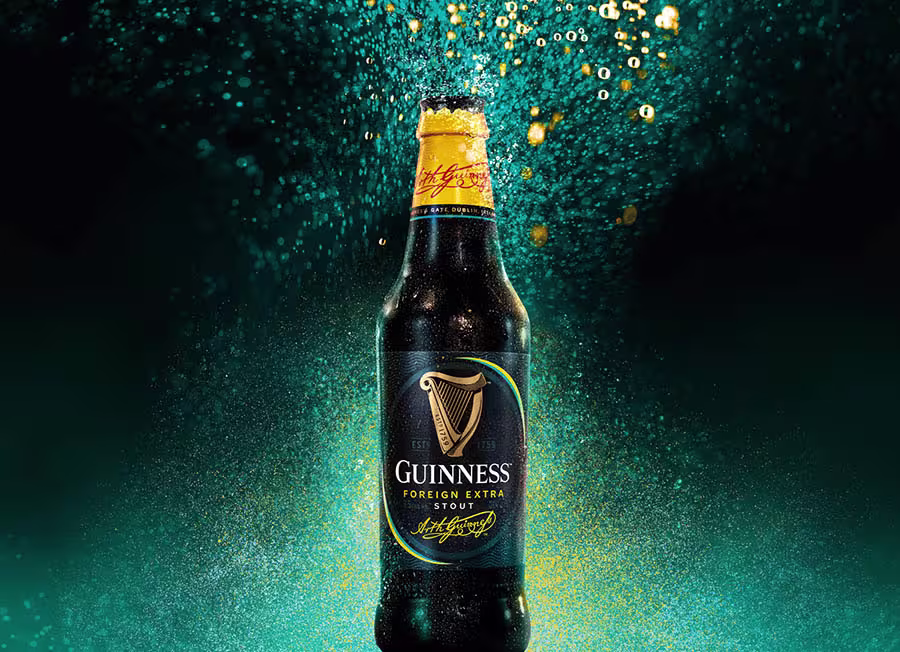 araffe beer bottle with a splash of water on it