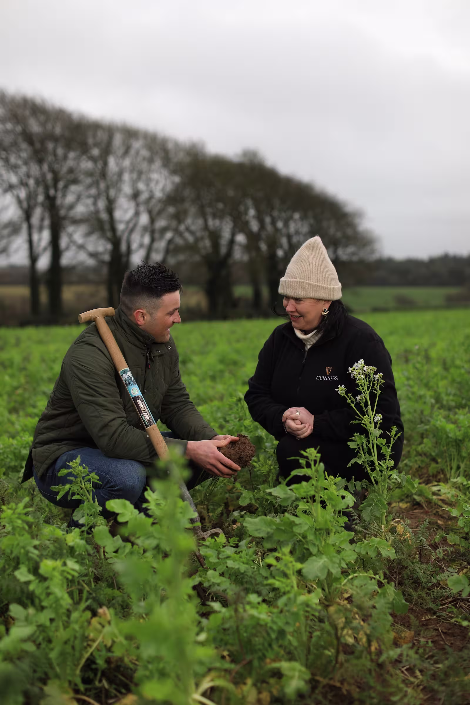there are two men in a field with a shovel and a pickle