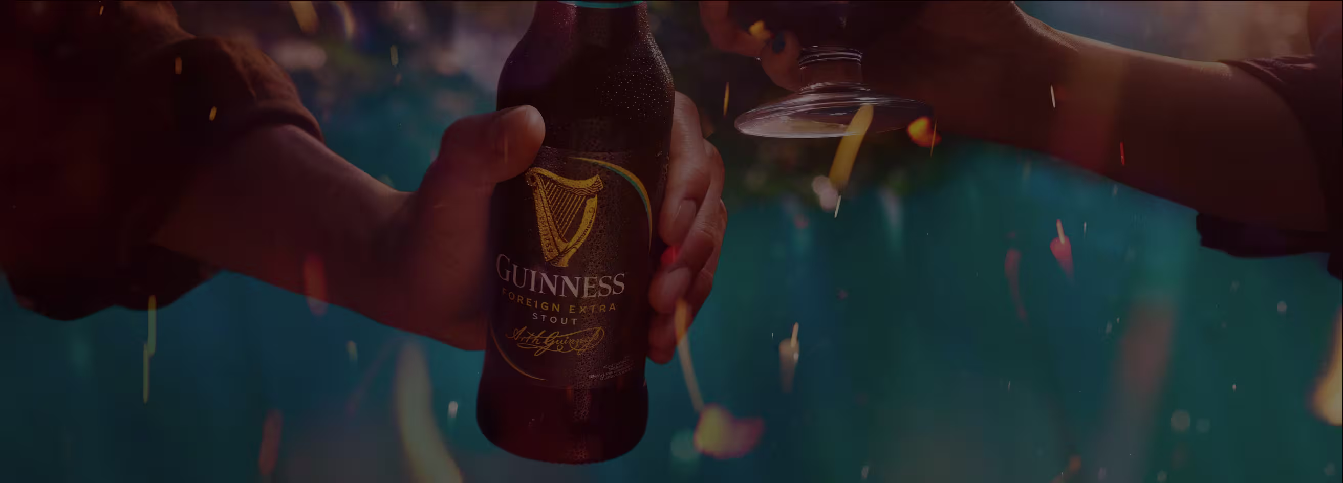GUINNESS FOREIGN EXTRA STOUT - Large hero glass and a bottle