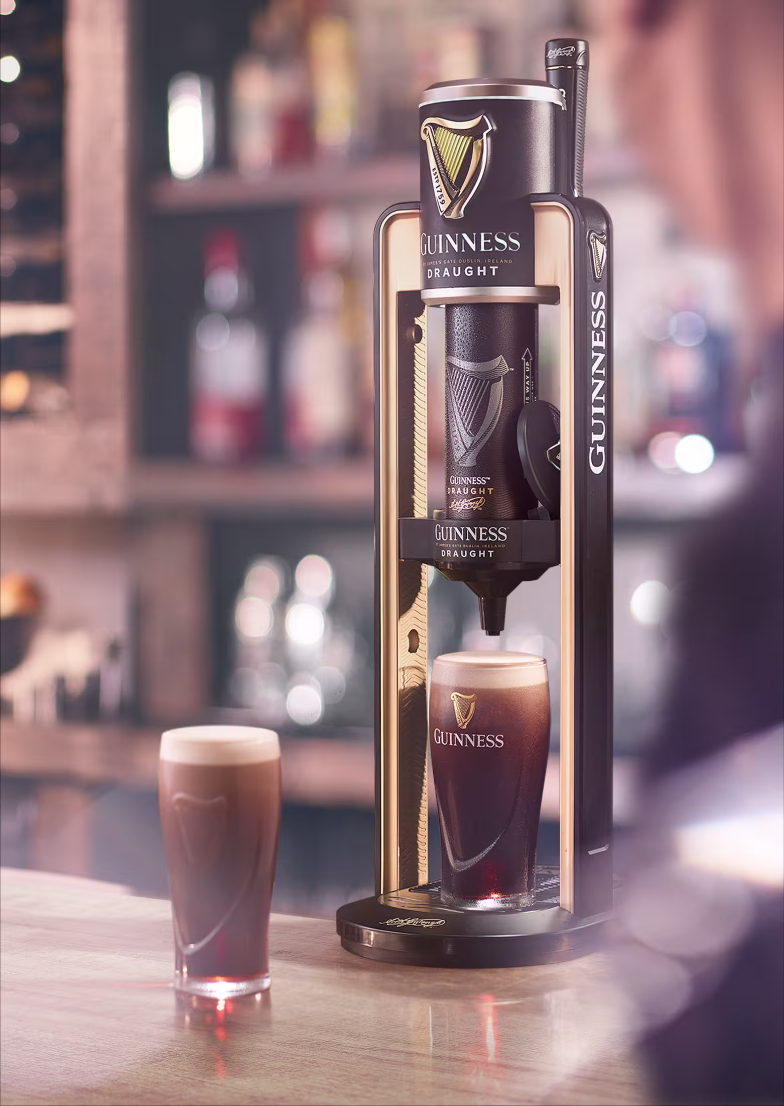there is a guinness coffee machine with a glass of guinness
