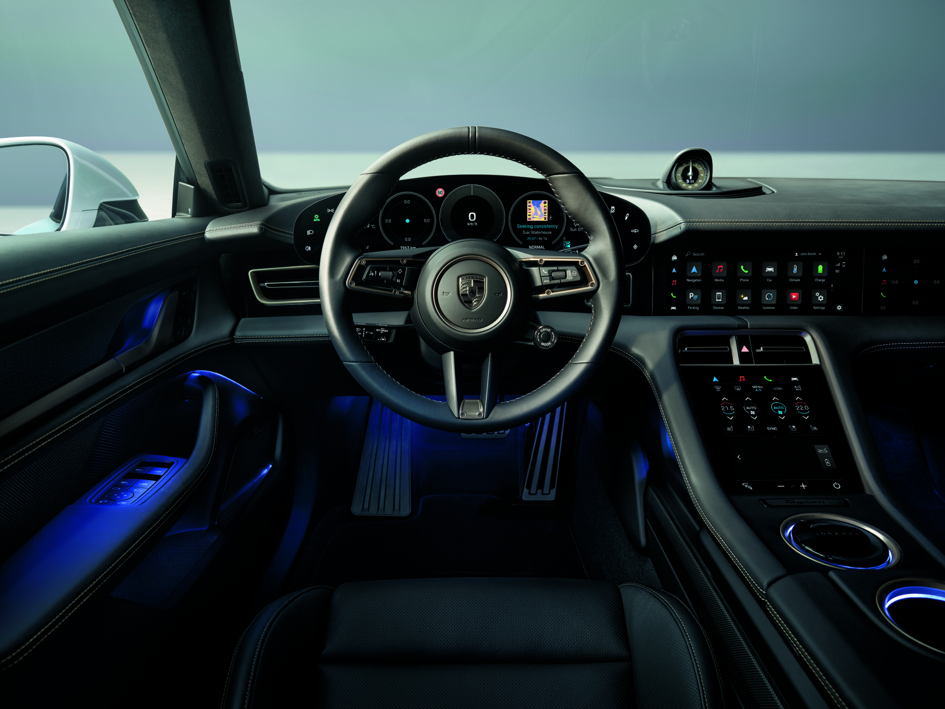 Showing the interior design of a macan, focusing on the wheel.