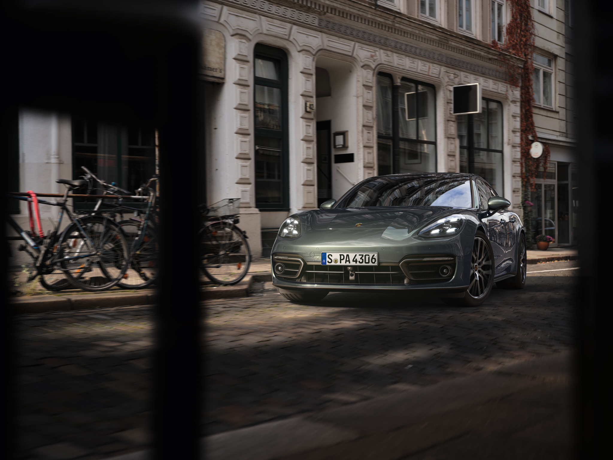 Red Porsche Panamera standing on a road