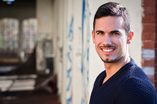 man smiling with a full head of hair