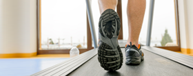 Feet moving on a treadmill