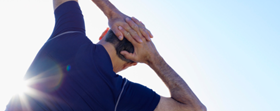 Person stretching with hands on their head