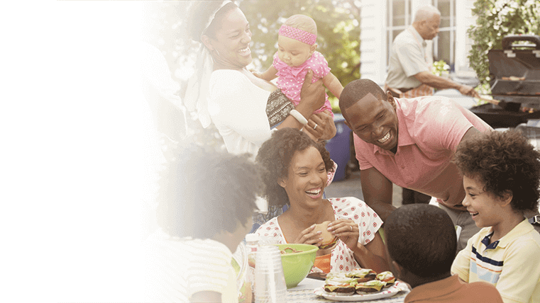 A family enjoying a meal and laughing