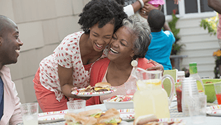 Family members laughing and eating together