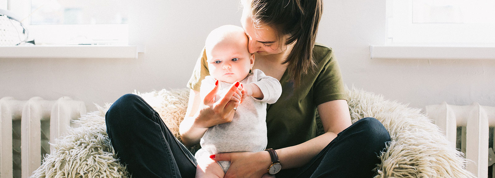 mother holding a baby