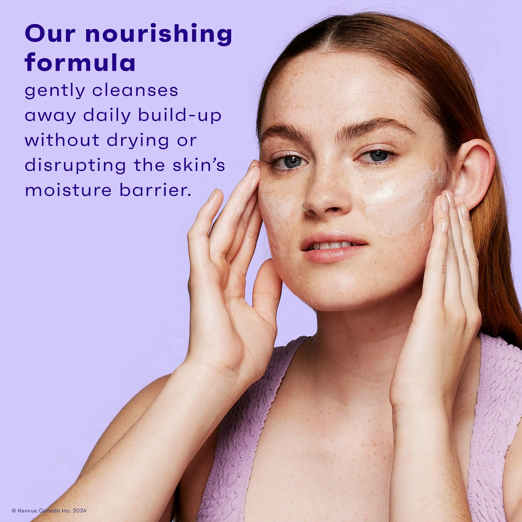 A young woman with fair skin using cleanser on her face