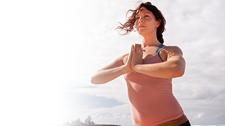 Woman in a starting yoga pose