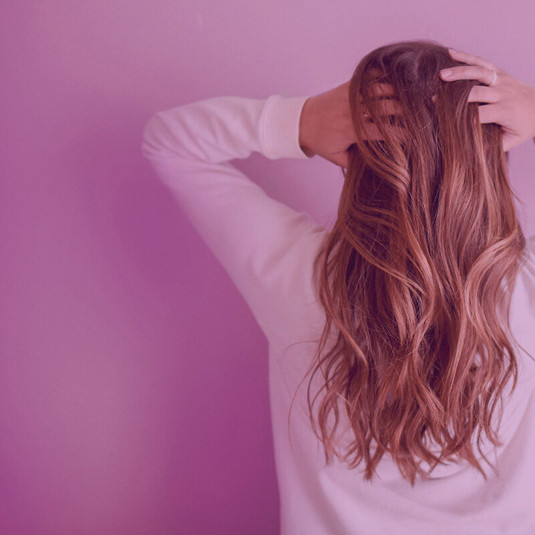 rear view of a womans head with long hair