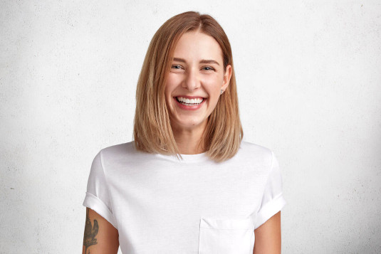 young woman with shoulder length hair smiling