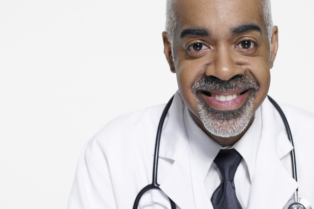 male doctor with a stethoscope over his neck