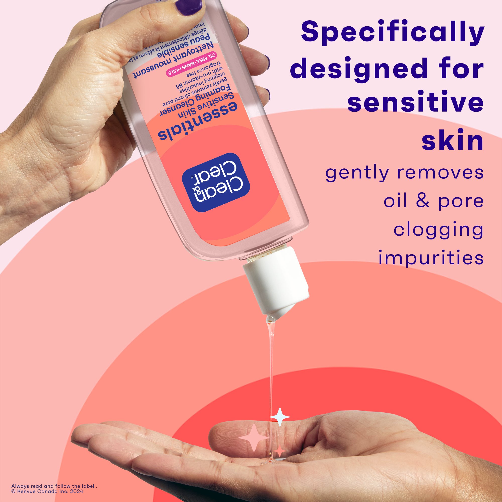 A hand is holding a bottle of Clean & Clear Essentials® Foaming Sensitive Skin Facial Cleanser and squeezing some of the product into the palm