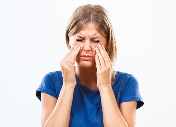 Woman experiencing sinus pain