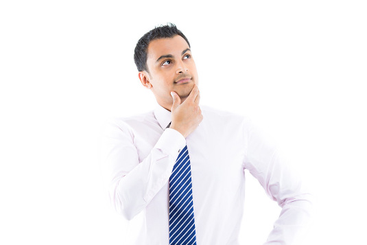 man in a dress shirt and tie thinking about hair regrowth