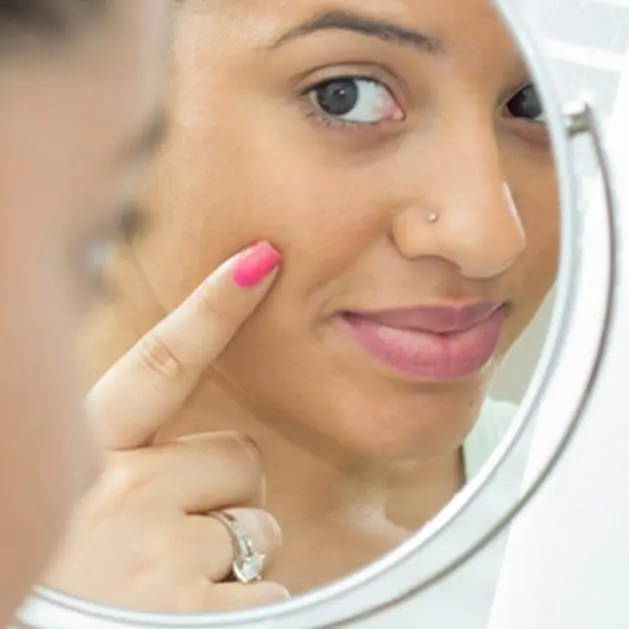 girl looking in the mirror