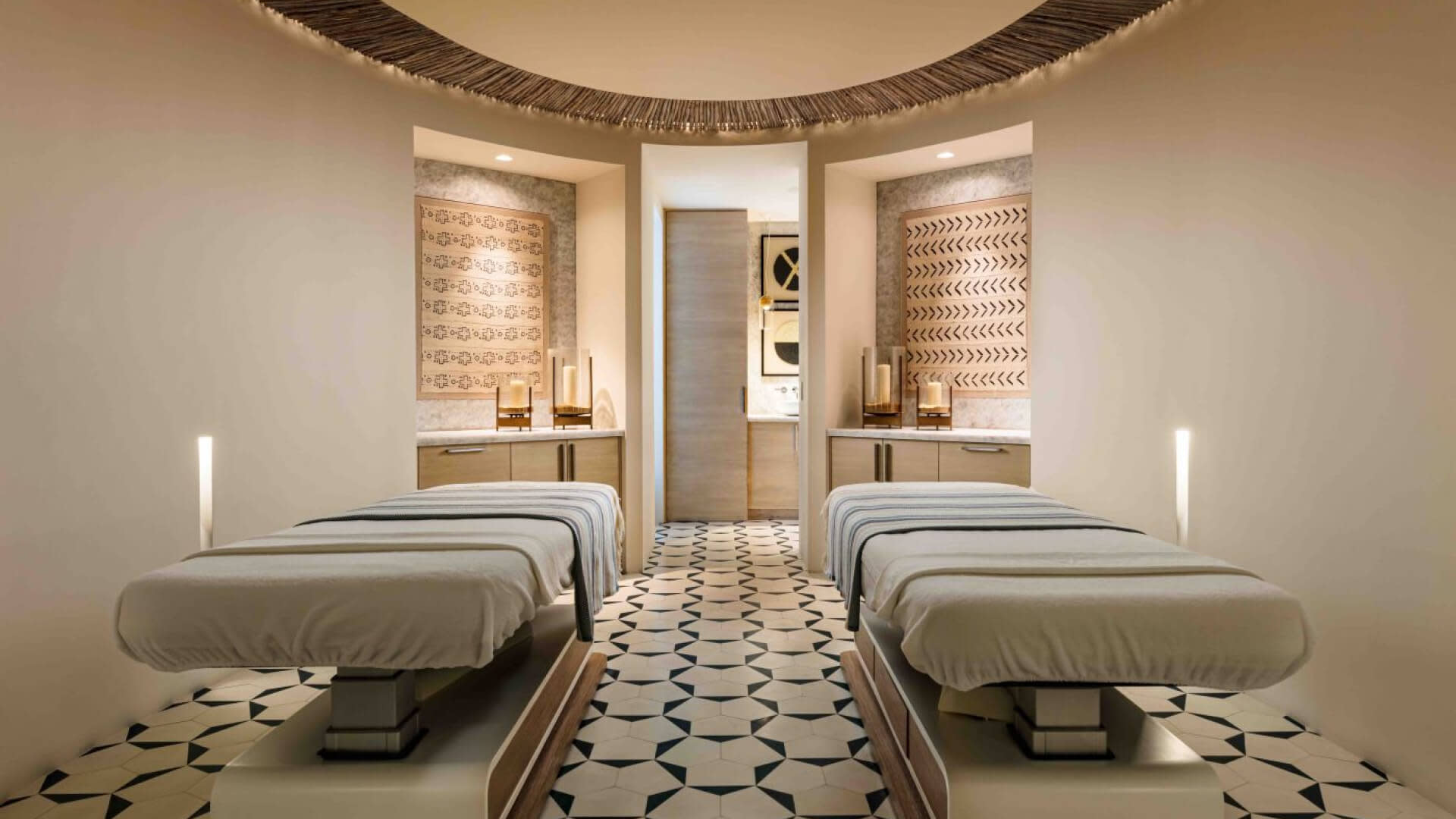 A spa room showcasing a peaceful environment with two elegant beds