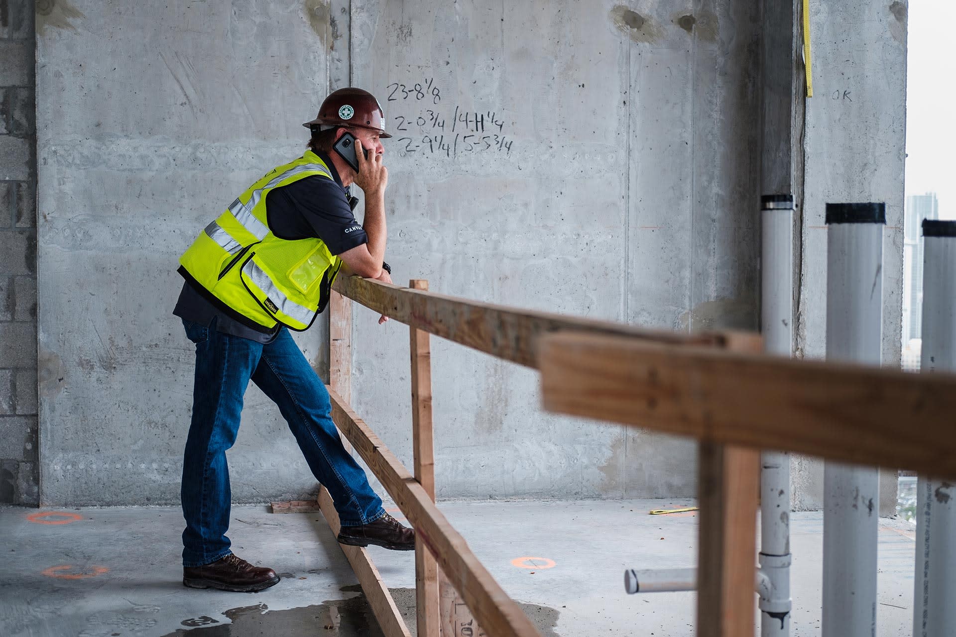 Construction worker talking on the phone on site