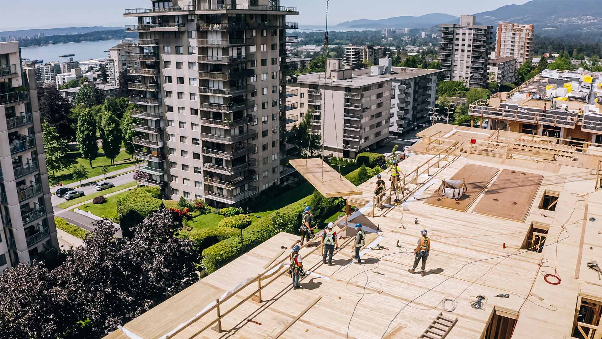 Construction workers finishing up a roof