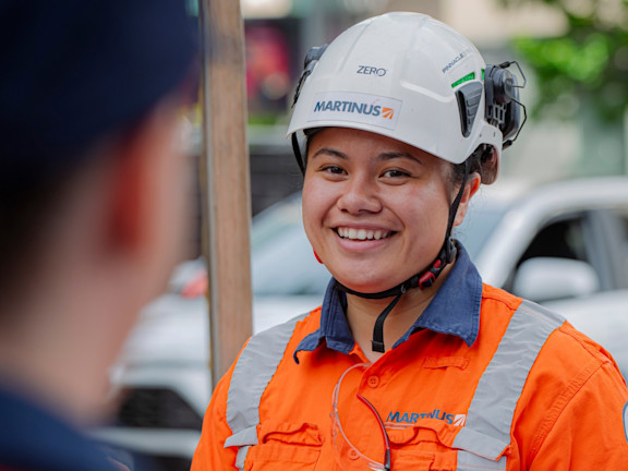 A Martinus contractor smiling to another contractor