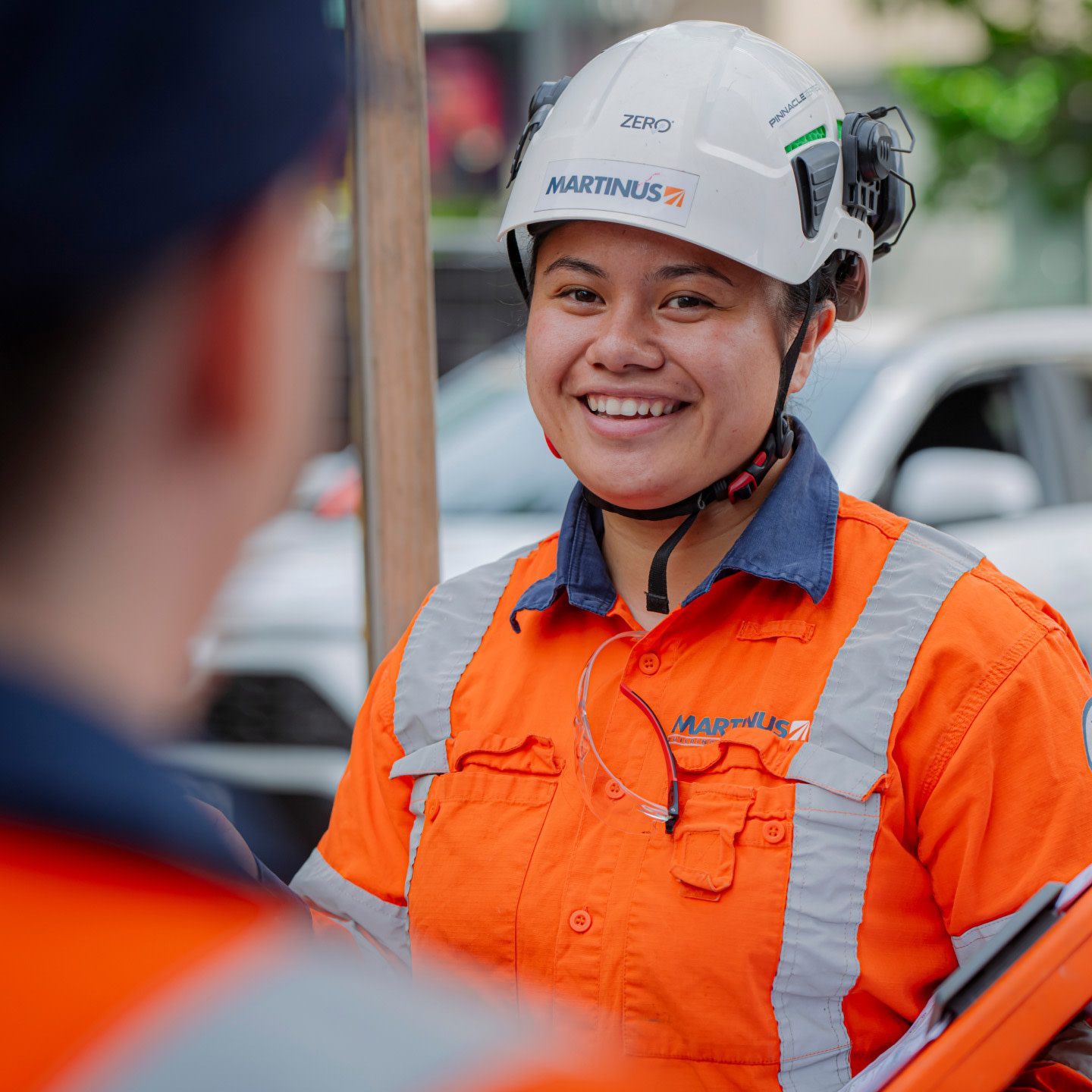 A Martinus contractor smiling to another contractor