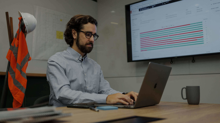 Person in office working a laptop