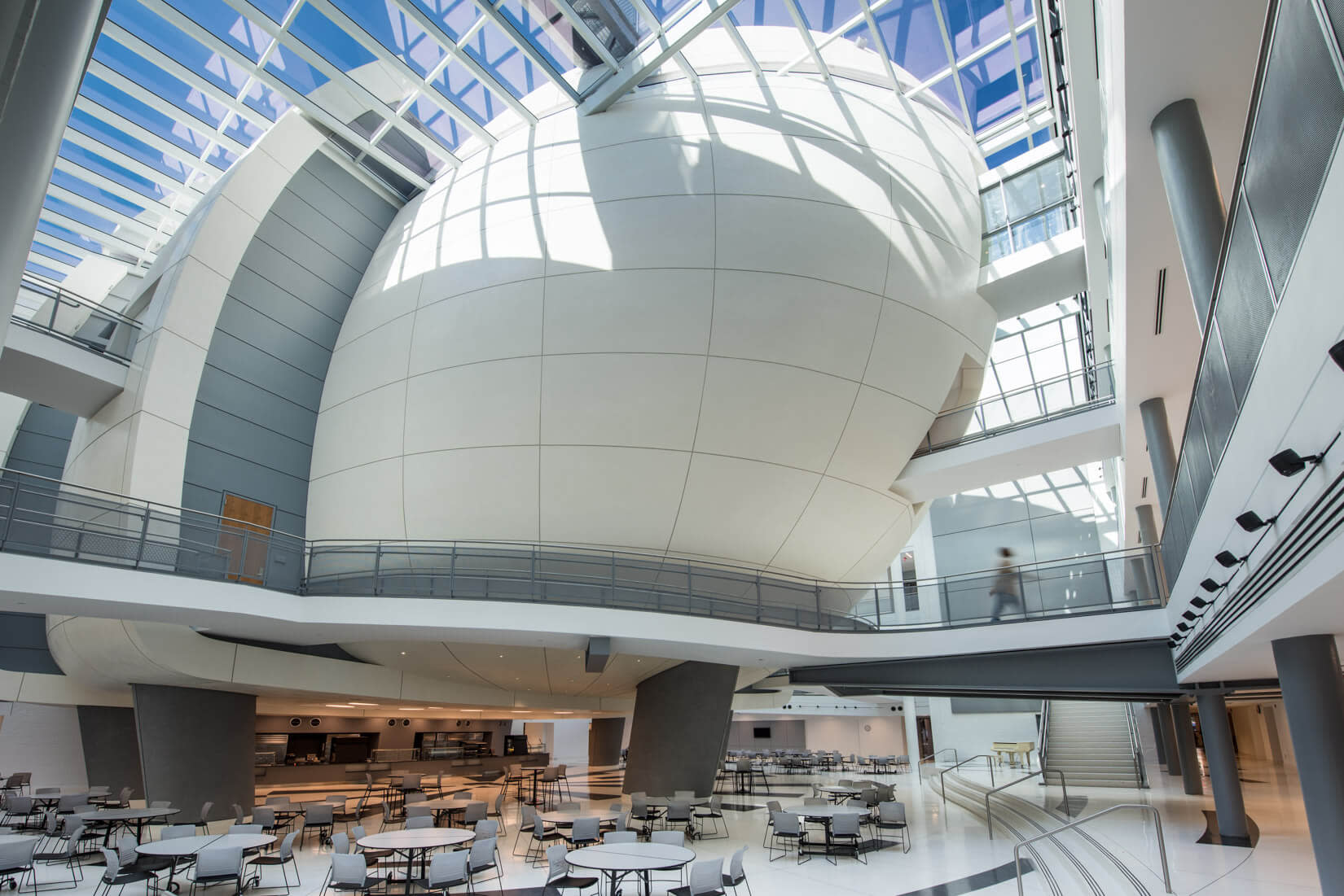 The atrium of a building, showcasing modern architecture and vibrant public spaces.