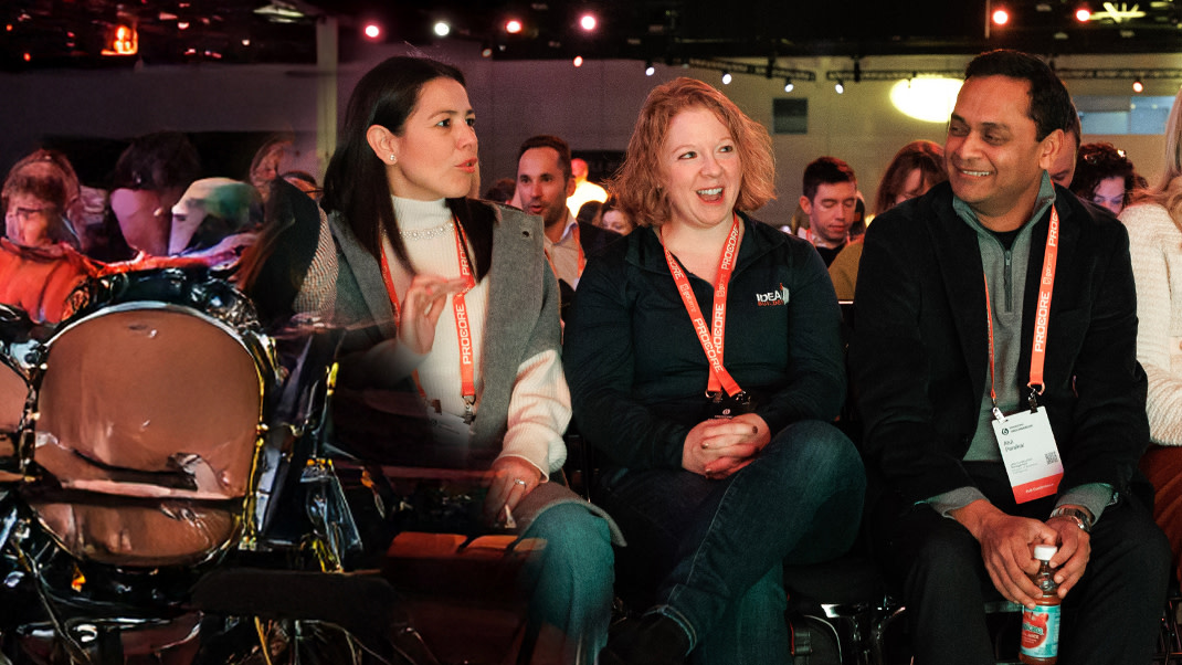 Three people having a conversation at an event
