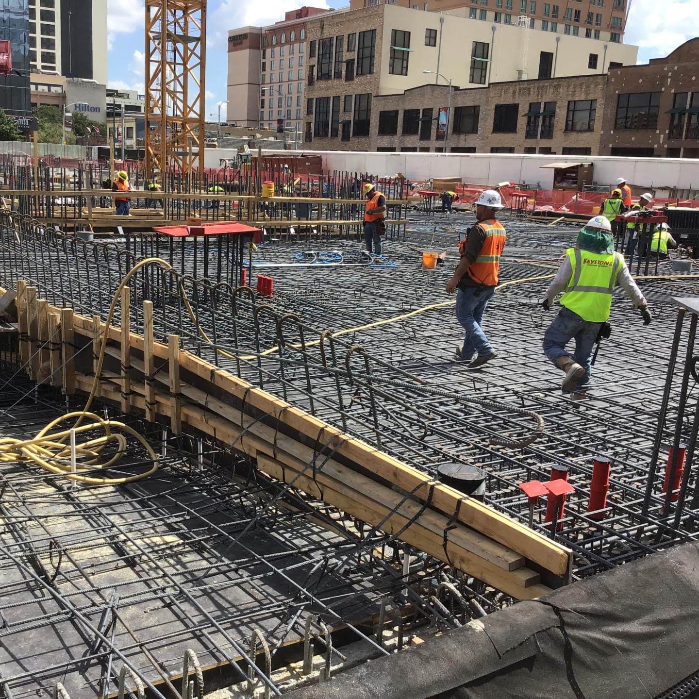 construction workers walking through job site