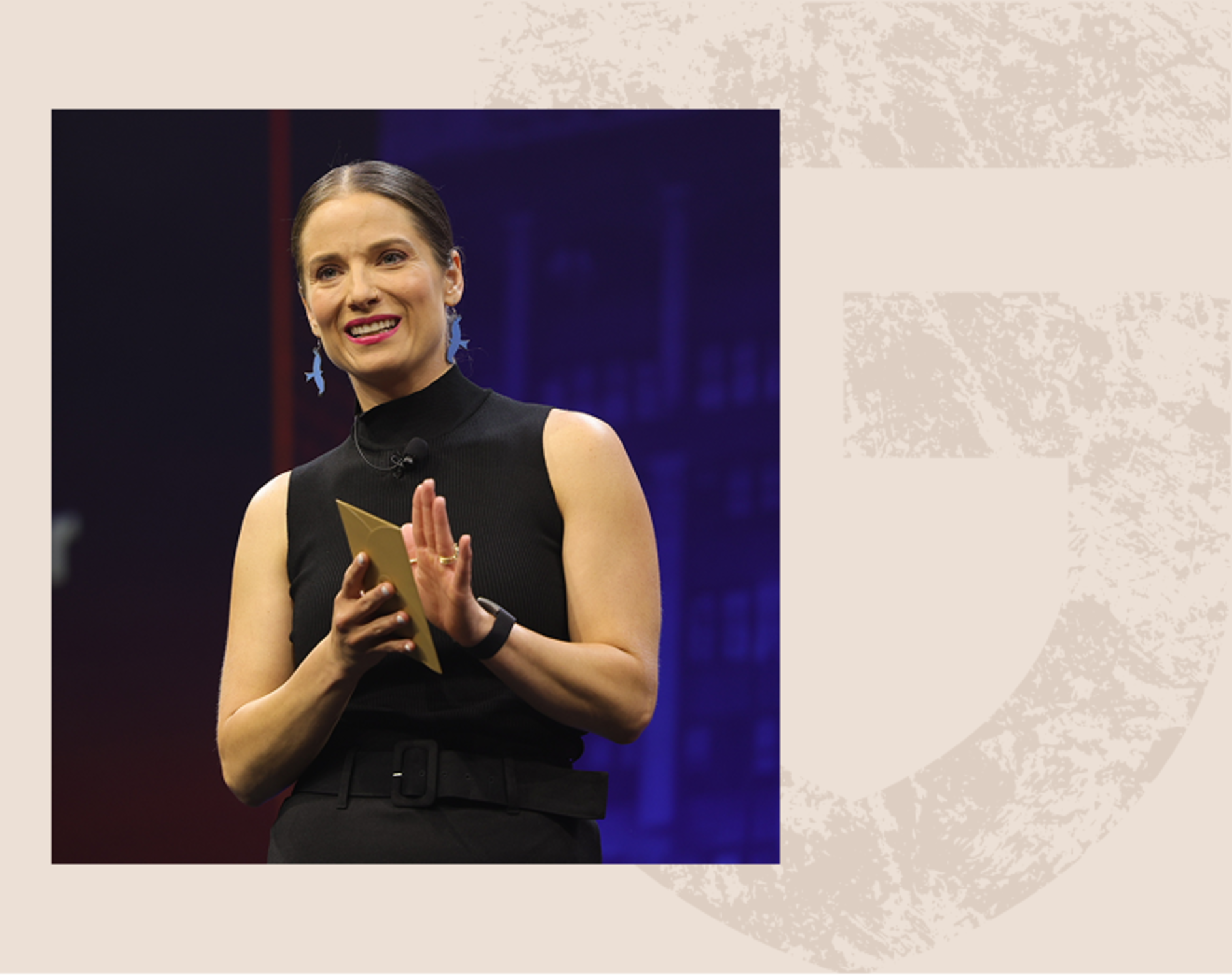 A woman speaking at Groundbreak's stage