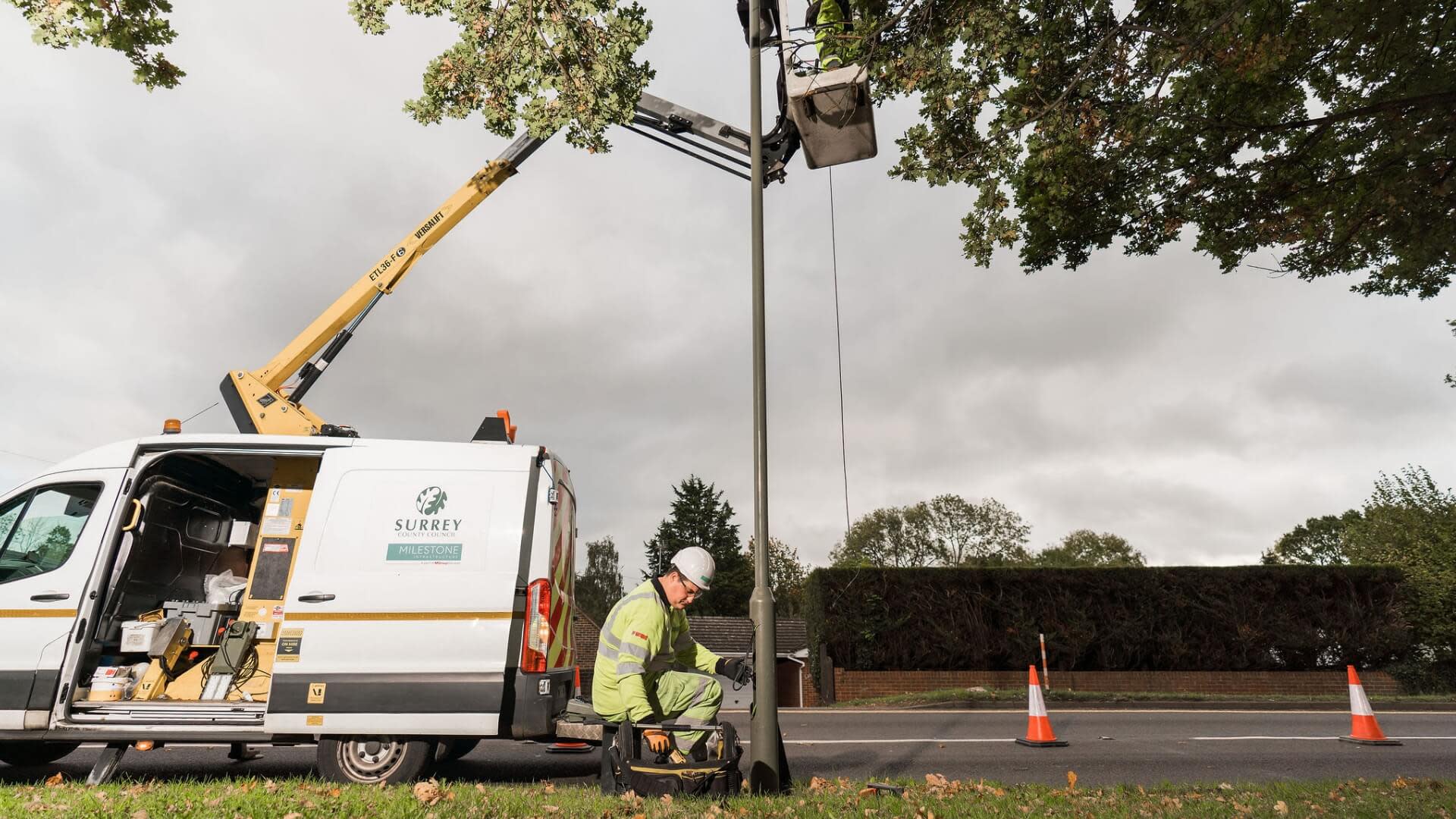 Contractor fixing a lamp post